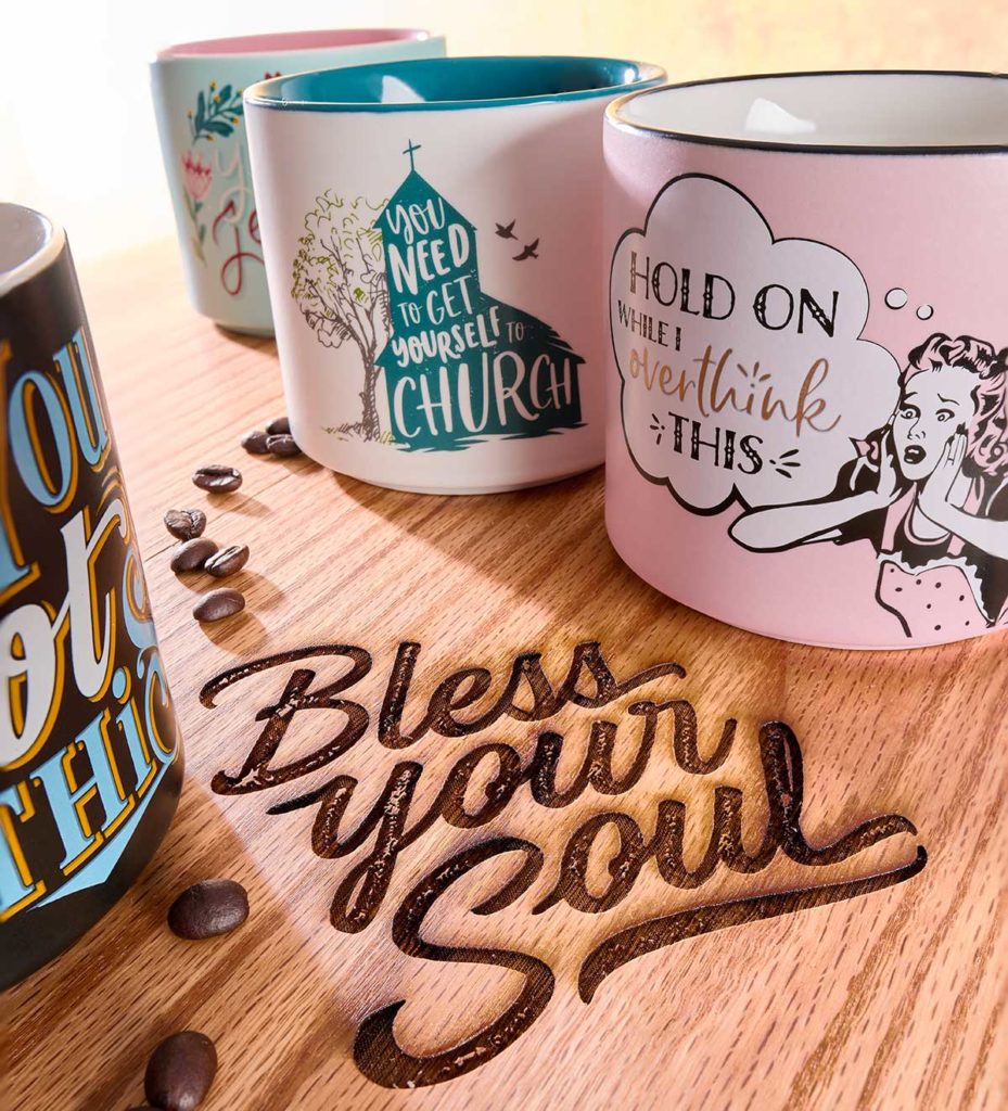 Bless Your Soul Mugs on table
